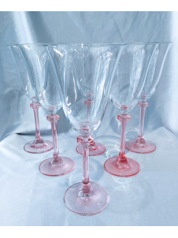 Angela wine glass on a pink...